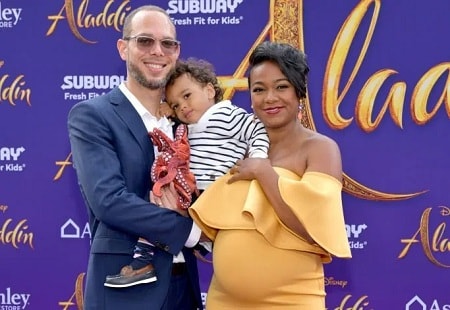 A picture of Vaugh Rasberry with his wife and elder son.